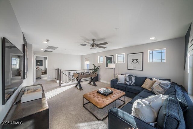 12233 W Caraveo Pl, Peoria, AZ 85383 - carpeted living area with a ceiling fan, recessed lighting, and baseboards