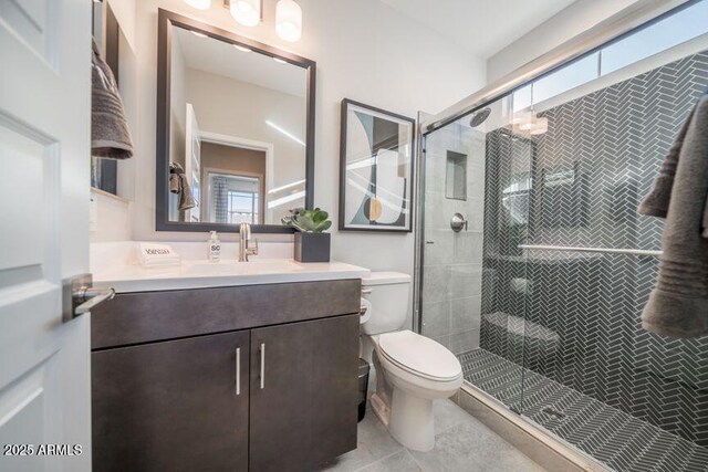 12233 W Caraveo Pl, Peoria, AZ 85383 - full bath featuring toilet, vanity, a stall shower, and tile patterned floors