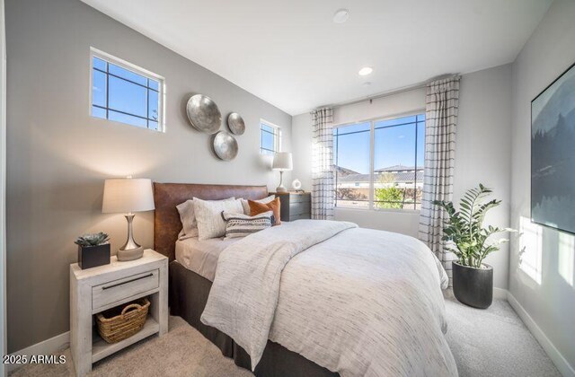 12233 W Caraveo Pl, Peoria, AZ 85383 - carpeted bedroom with multiple windows and baseboards