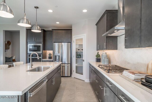 12233 W Caraveo Pl, Peoria, AZ 85383 - kitchen featuring a sink, appliances with stainless steel finishes, wall chimney range hood, light countertops, and recessed lighting