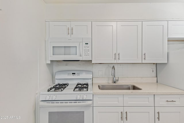 3128 W Pima St Unit 2, Phoenix, AZ 85009 - kitchen featuring white appliances, backsplash, light countertops, and white cabinets