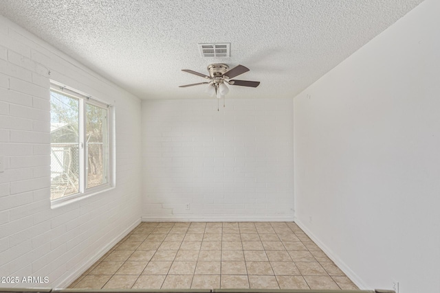 3128 W Pima St Unit 2, Phoenix, AZ 85009 - empty room featuring a textured ceiling, ceiling fan, and light tile patterned floors