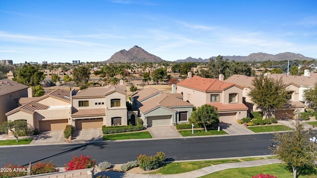 birds eye view of property with a mountain view