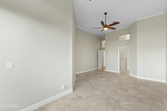 empty room with ornamental molding and ceiling fan