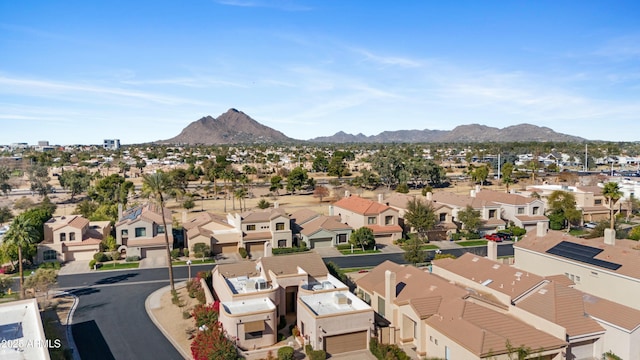 birds eye view of property with a mountain view