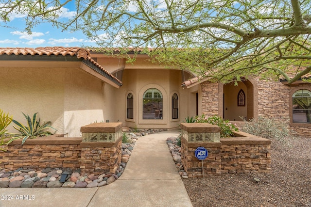 15857 E Ponderosa Dr, Fountain Hills, AZ 85268 - entrance to property with stucco siding, a tiled roof, and stone siding