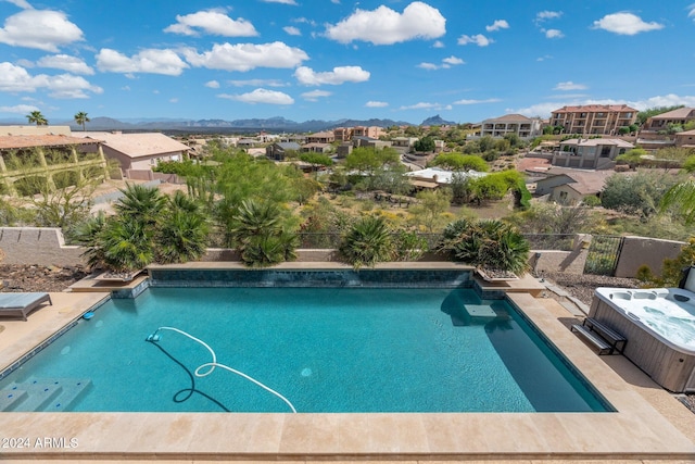 15857 E Ponderosa Dr, Fountain Hills, AZ 85268 - view of swimming pool with a hot tub, a fenced backyard, a residential view, and a mountain view