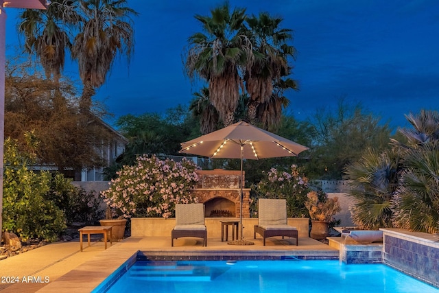 15857 E Ponderosa Dr, Fountain Hills, AZ 85268 - pool at night with an outdoor pool and a patio