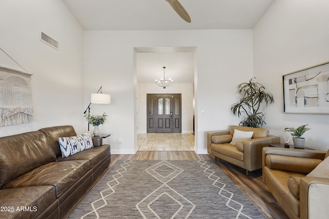 15857 E Ponderosa Dr, Fountain Hills, AZ 85268 - living room with a chandelier, wood finished floors, baseboards, and a ceiling fan