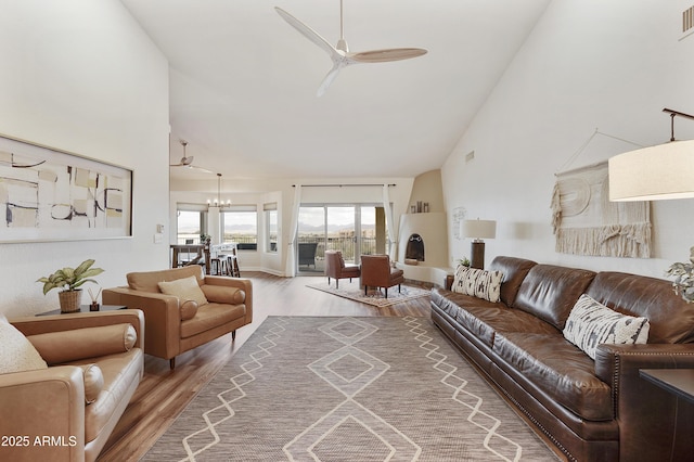 15857 E Ponderosa Dr, Fountain Hills, AZ 85268 - living room featuring ceiling fan, wood finished floors, a chandelier, and high vaulted ceiling