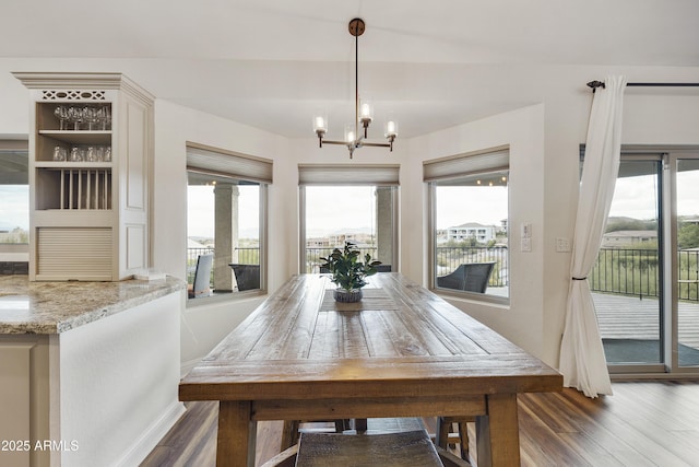 15857 E Ponderosa Dr, Fountain Hills, AZ 85268 - dining area with baseboards, wood finished floors, a chandelier, and plenty of natural light