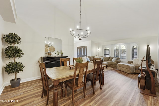 15857 E Ponderosa Dr, Fountain Hills, AZ 85268 - dining area featuring a chandelier, light wood finished floors, baseboards, and high vaulted ceiling