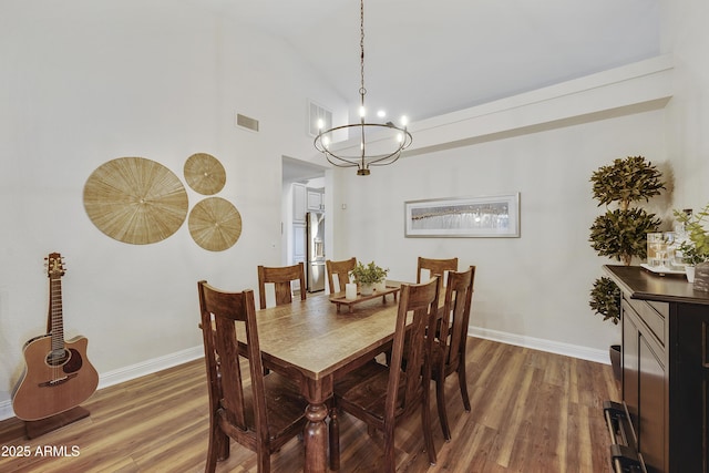 15857 E Ponderosa Dr, Fountain Hills, AZ 85268 - dining room with a chandelier, wood finished floors, baseboards, and high vaulted ceiling