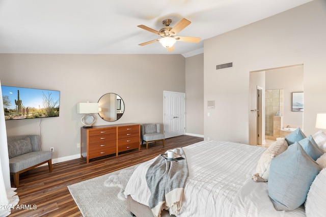 bedroom with high vaulted ceiling, ensuite bath, dark hardwood / wood-style floors, and ceiling fan