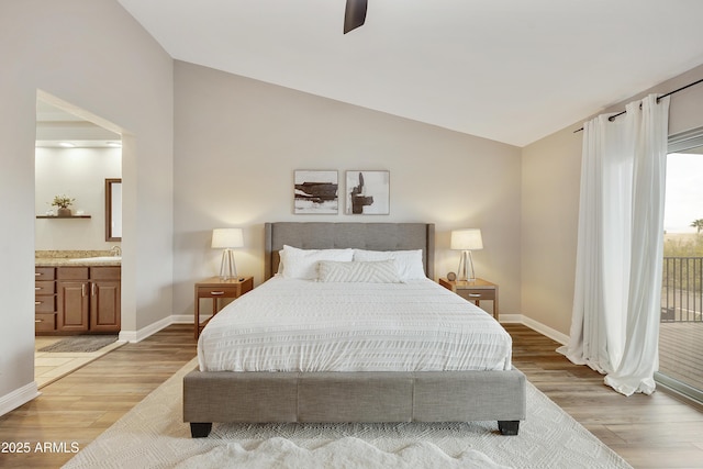 15857 E Ponderosa Dr, Fountain Hills, AZ 85268 - bedroom with lofted ceiling, light wood-style flooring, and baseboards