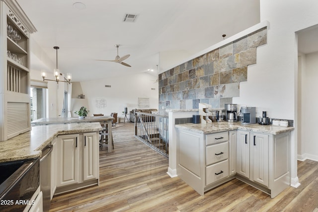15857 E Ponderosa Dr, Fountain Hills, AZ 85268 - kitchen with a ceiling fan, light wood-style floors, hanging light fixtures, light stone countertops, and lofted ceiling