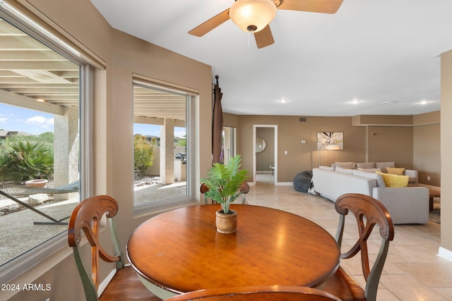 dining space featuring a healthy amount of sunlight and ceiling fan