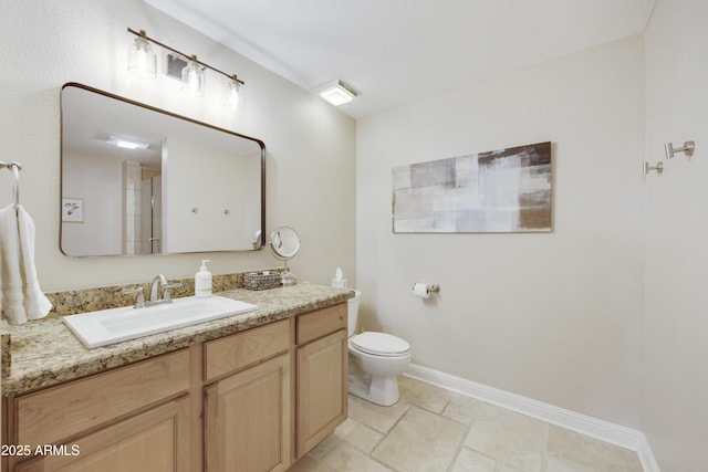 15857 E Ponderosa Dr, Fountain Hills, AZ 85268 - bathroom with toilet, baseboards, and vanity