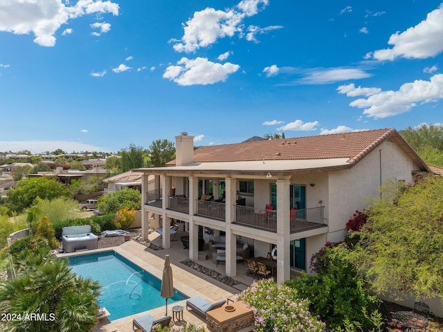 15857 E Ponderosa Dr, Fountain Hills, AZ 85268 - rear view of property featuring a balcony, an outdoor living space, stucco siding, a hot tub, and a patio