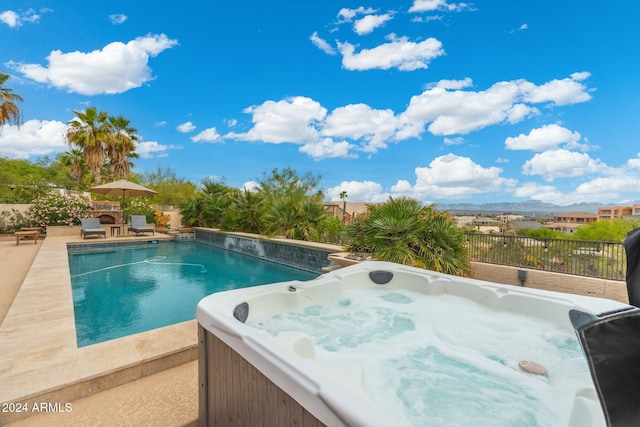 15857 E Ponderosa Dr, Fountain Hills, AZ 85268 - view of pool with a hot tub, fence, a patio, and a mountain view
