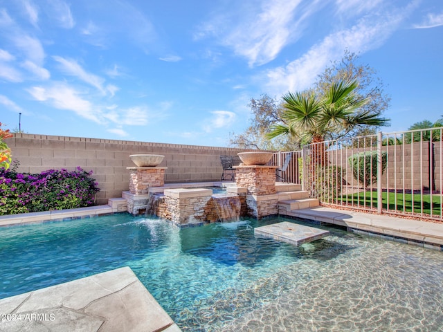 view of swimming pool with pool water feature