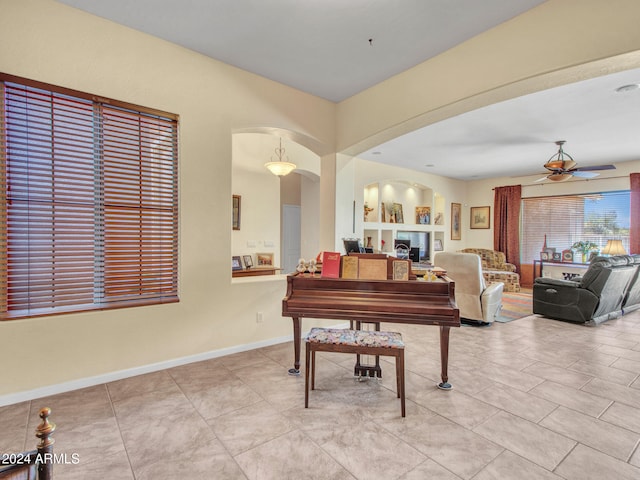 miscellaneous room with ceiling fan and light tile patterned flooring