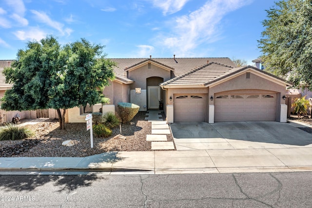 ranch-style home featuring a garage