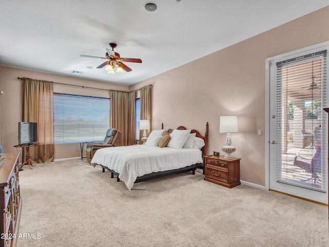 bedroom with light carpet, access to outside, and ceiling fan