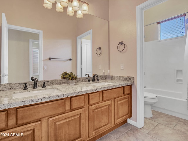 bathroom featuring vanity, toilet, and tile patterned flooring