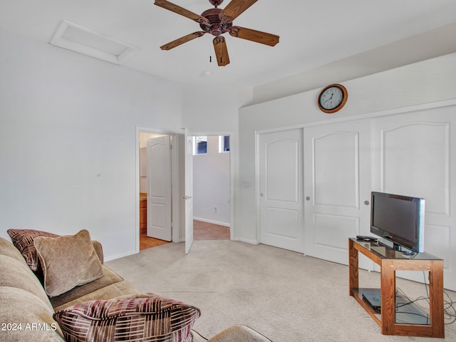 carpeted living room with ceiling fan