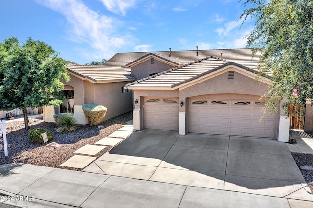 ranch-style home featuring a garage