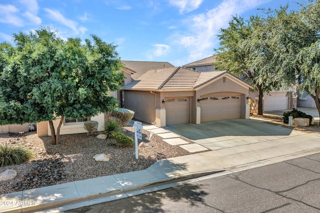 view of front of property with a garage