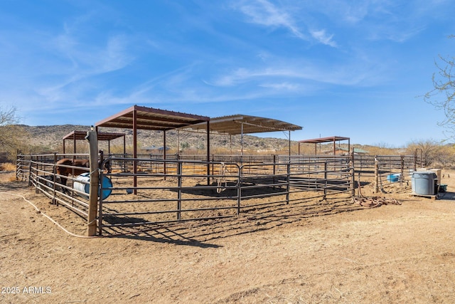 view of stable featuring a rural view