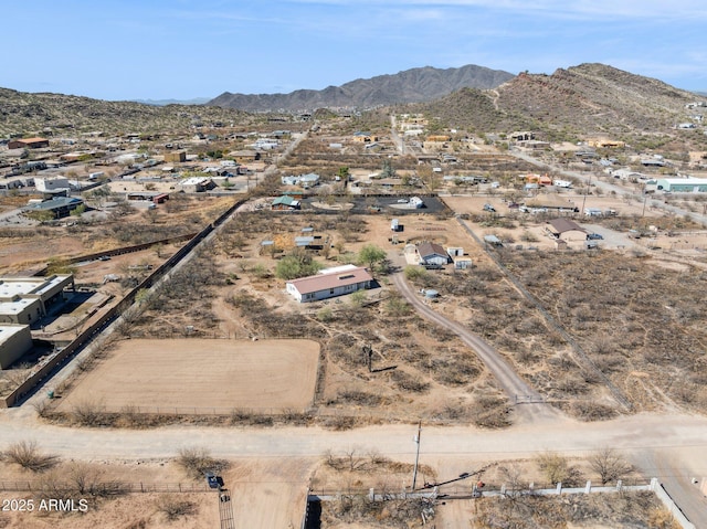 birds eye view of property with a mountain view