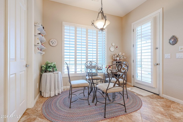 dining space with light tile patterned flooring