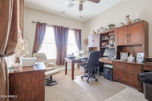 office area featuring light carpet and ceiling fan