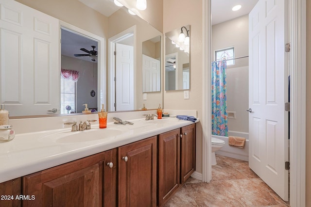 full bathroom with ceiling fan, shower / tub combo with curtain, vanity, and toilet