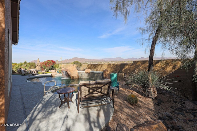 view of patio / terrace featuring a mountain view