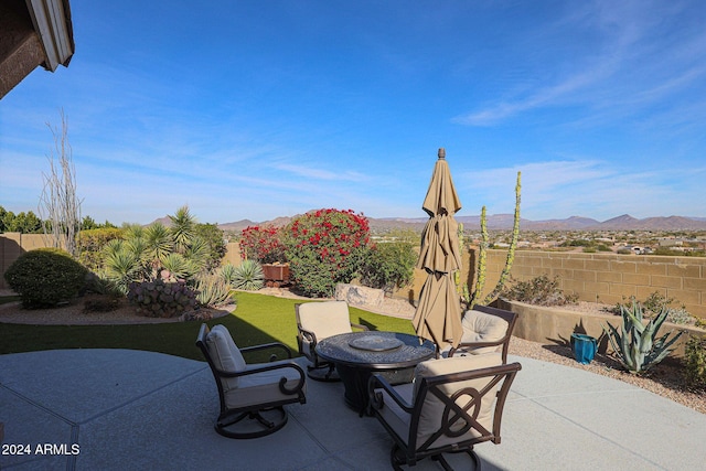 view of patio / terrace featuring a mountain view