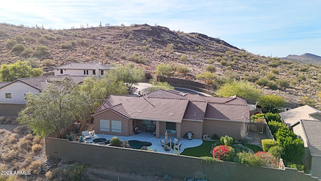 birds eye view of property with a mountain view