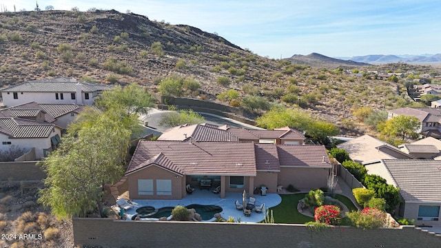 birds eye view of property with a mountain view