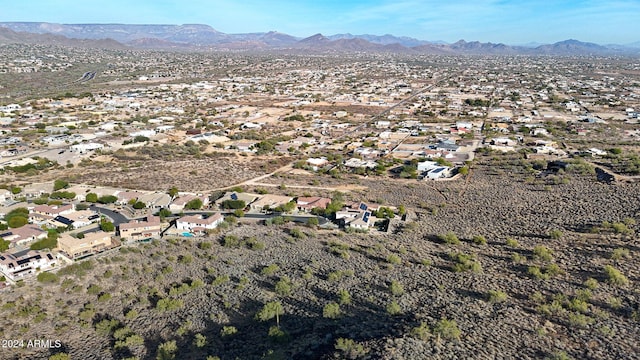 birds eye view of property featuring a mountain view