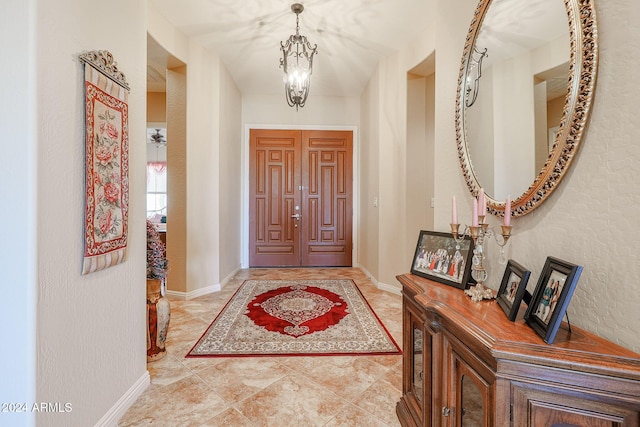 foyer with a notable chandelier