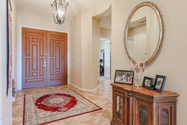 entryway featuring a chandelier