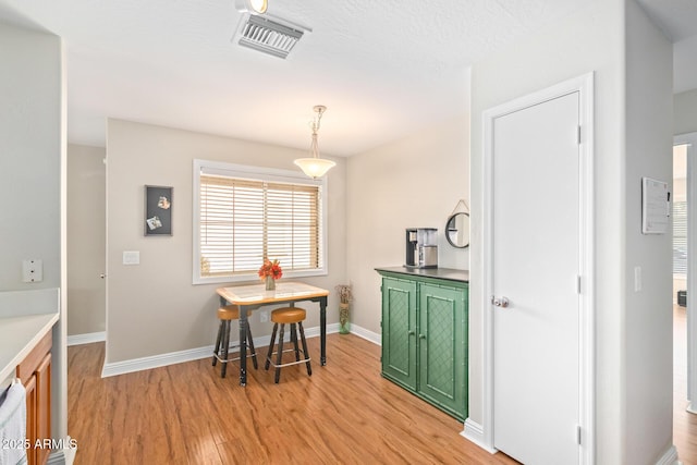 dining area with light wood-type flooring