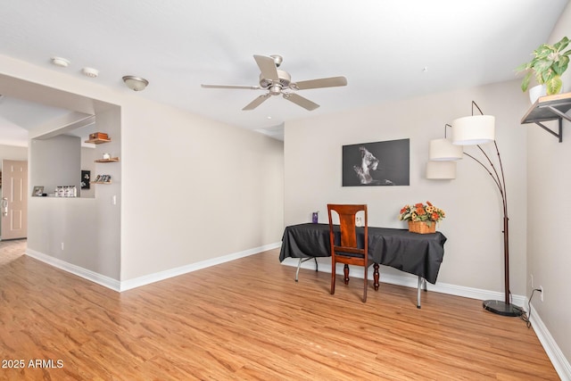 sitting room with ceiling fan and light hardwood / wood-style floors