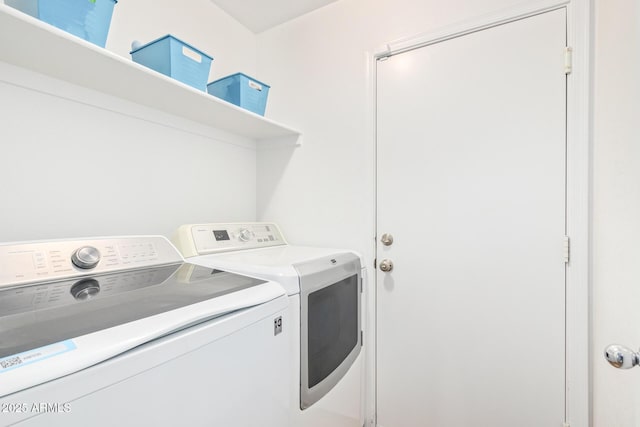 clothes washing area featuring independent washer and dryer