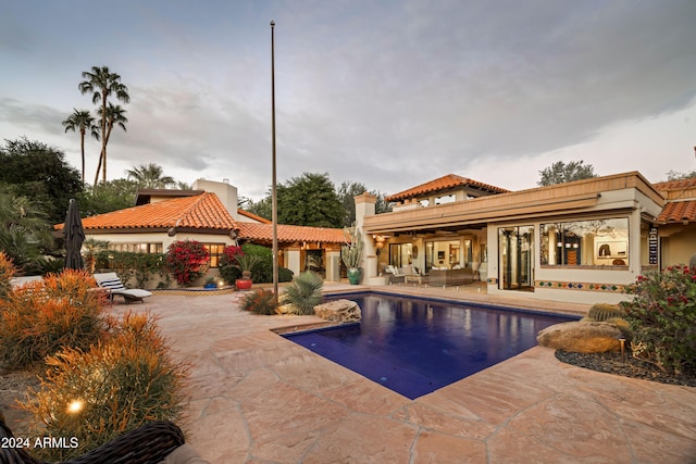 view of pool featuring a patio