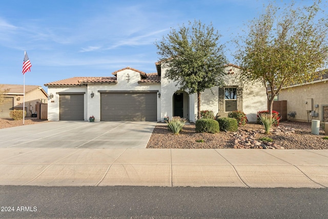 mediterranean / spanish-style home featuring a garage