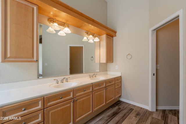 1555 E Monterey St, Chandler, AZ 85225 - bathroom featuring double vanity, wood finished floors, and baseboards